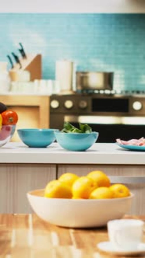 Colorful fruits and vegetables arranged on kitchen counter