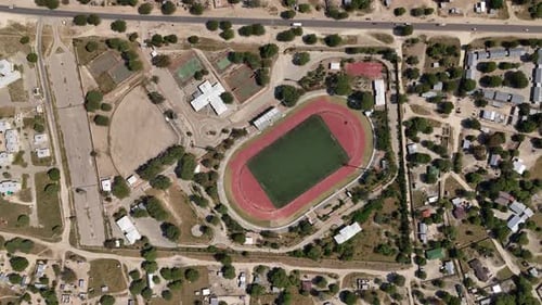 Maun Sports Complex Top - Down - 4K slow smooth Establishing Drone shot