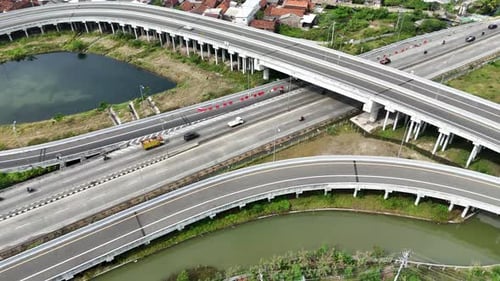 Aerial view of highway traffic near house building