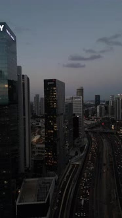 Aerial Shot Of Cityscape By Sea Against Sky At Sunset, Drone Descending Forward Over City - Tel Aviv