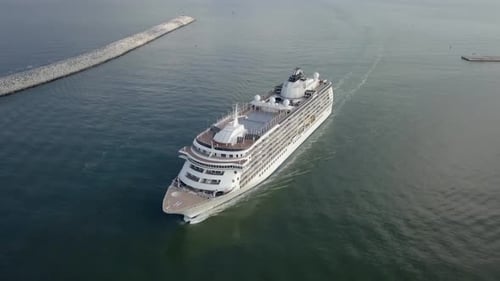 Large cruise ship at sea - Aerial footage at sunrise.
