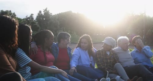 Group of Multigenerational People Enjoy Day at City Park - Multiracial Friends