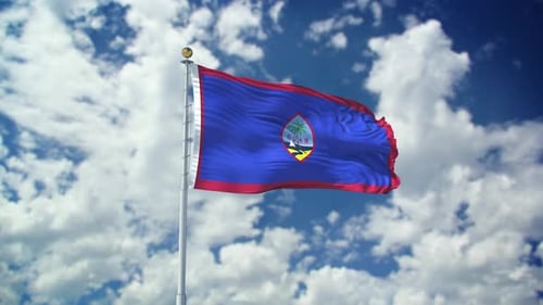 Guam Flag Waving Proudly Against Cloudy Blue Sky