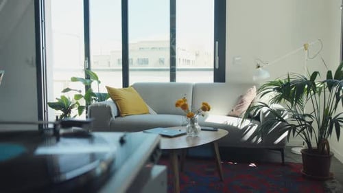 Man Listening to Vinyl Record at Home