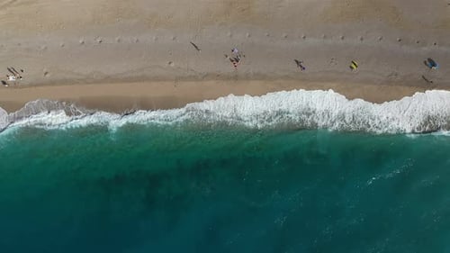 Drone View of Sandy Beach with Turquoise Sea Waves