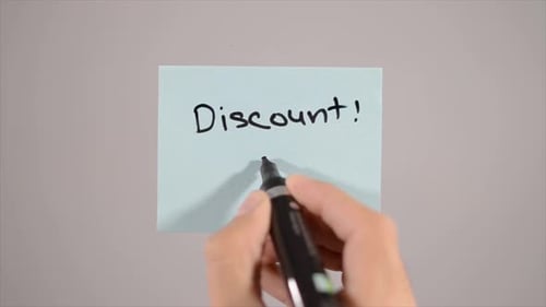 Writing Discount Message on Sticky Note