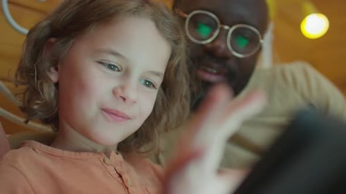 Child Looking at Screen of Tablet