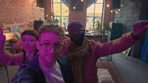 Young Man At Party With Friends