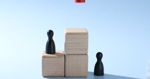Wooden Blocks and Game Pieces Showing Business Growth