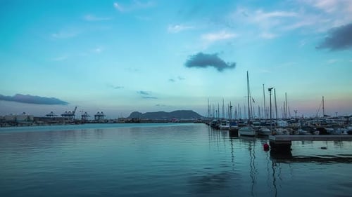 A Time Lapse Shot Of A Sunset To A Twilight View And Yachts At The Harbor