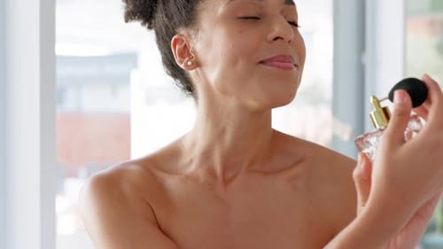 Black woman, perfume or aroma scent bottle in house, home or hotel bathroom in luxury beauty