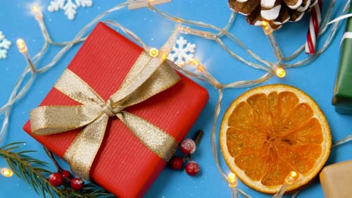 Festive Christmas gifts and decorations on blue background