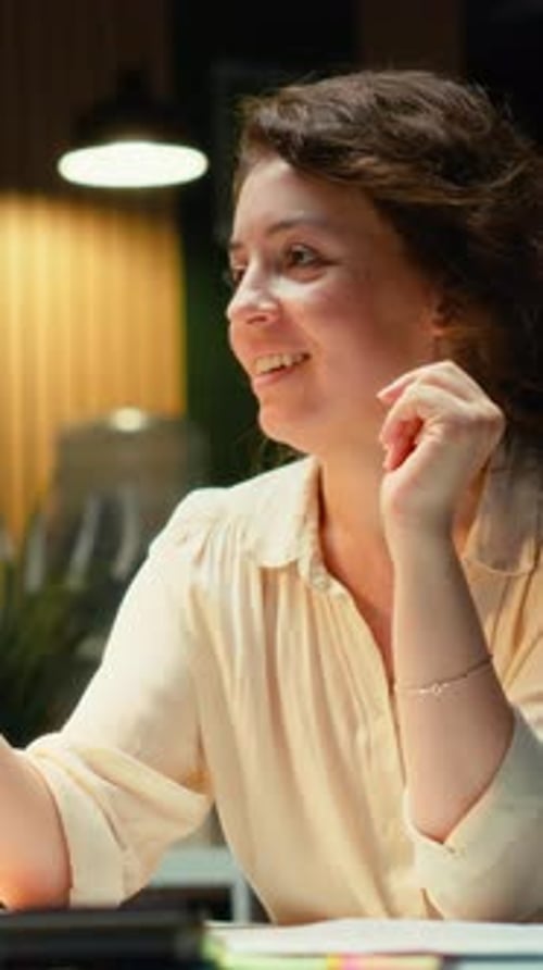 Vertical Video Businesswoman in the Office Engages in Communication During Virtual Presentation