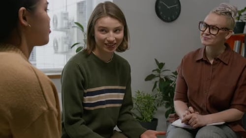 Therapy Session With Three People Talking and Listening