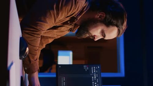 Computer Engineer Deliberating Ways of Fixing Errors While Developing Code