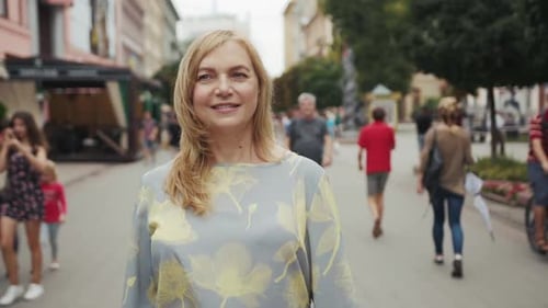 Cute Middle Aged Blond Woman Looking Into Camera Stand City Center Smile Happy Close Up Face
