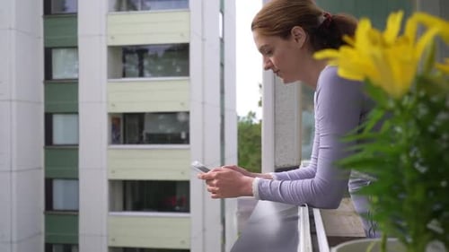 Woman on Balcony Gasps in Fright