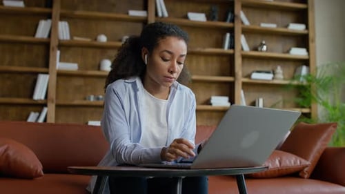 Young Entrepreneur Working on Laptop in Office