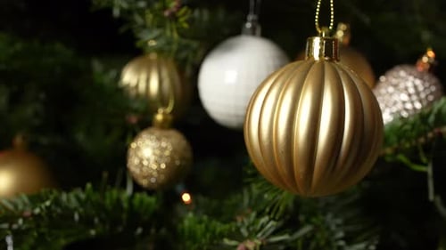 Christmas Ornaments Hanging on Decorated Christmas Tree