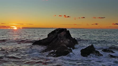 Sea and Rocks During Beautiful Sunset
