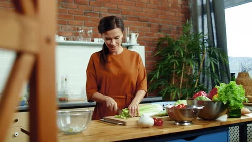 Woman Prepares Healthy Meal in Modern Kitchen