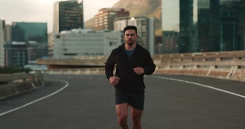 Running, fitness and face of man in city for marathon training, exercise and cardio workout