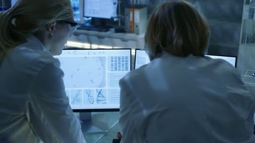 Scientists Analyzing Data in Modern Lab