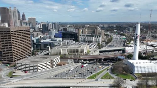 Aerial timelapse of Downtown Atlanta highway traffic during rush hour, Atlanta skyline buildings on