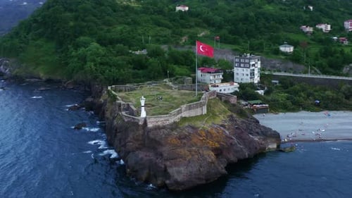 Aerial view of a small castle perched on a scenic spire. Espiye Andoz castle.Giresun,Turkey