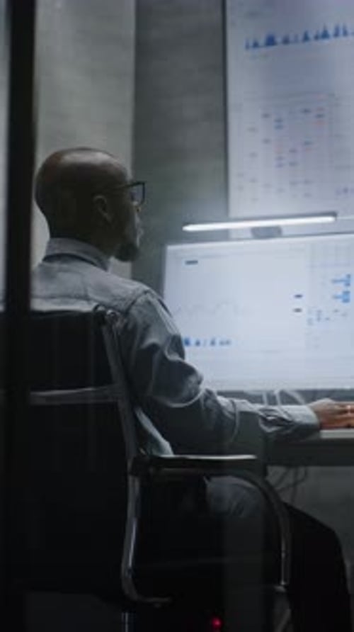 Financial Analyst Working on Computer with MultiMonitor Workstation Analyzing RealTime Stocks