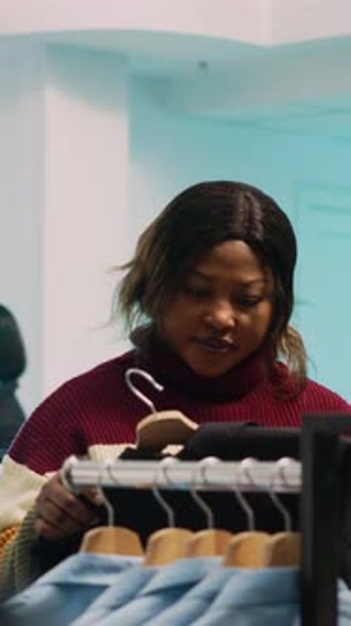 Vertical Video Store Assistant Helping Woman to Choose Trendy Clothes