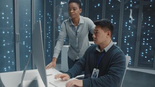 Computer Engineers Work in Data Center on Code