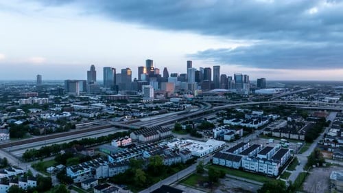 Stunning Aerial Views of Houston Texas at Dusk Showcasing the City's Skyline Highways and Urban