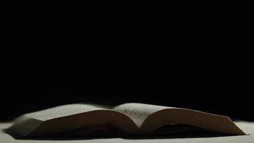 Open Book with Dust Particles Floating in the Air