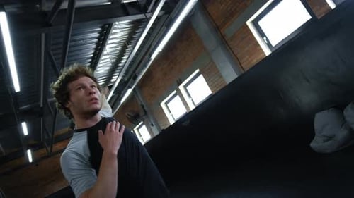 Portrait of Eager Kickboxer Doing Repetitions at Gym. Closeup Active Sportsman Training