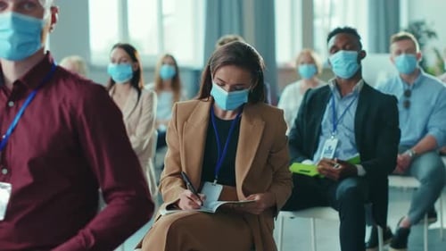 People Attending a Business Meeting Wearing Surgical Masks
