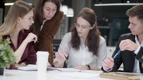 Business Team Discussing Project in Modern Office