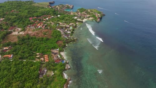 Aerial view of Blue Lagoon and coastline with boats, Indonesia.