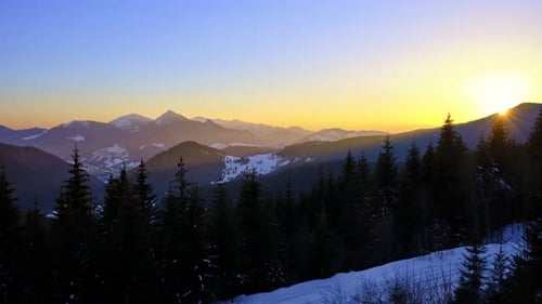 Colorful Sunset in Mountain Winter Landscape