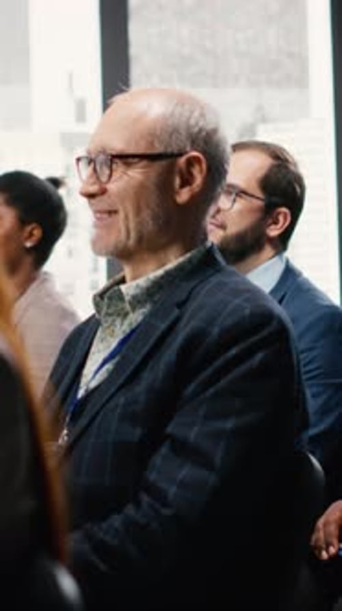 Diverse Group Attends Business Meeting in Modern Office