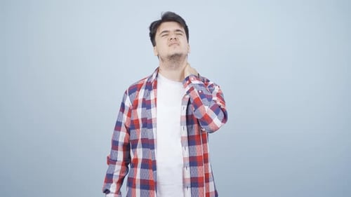 Man Rubbing Neck Experiencing Pain
