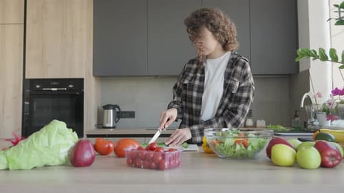 Young Woman Prepares Healthy Meal in Bright Kitchen