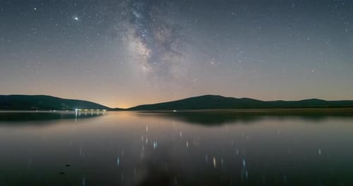 Milky way reflection in a lake in Ciudad Real, Castilla la Mancha, Spain. Starry sky on a dark night