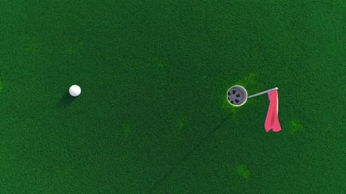 Aerial View of Golf Ball Near Hole on Green Course