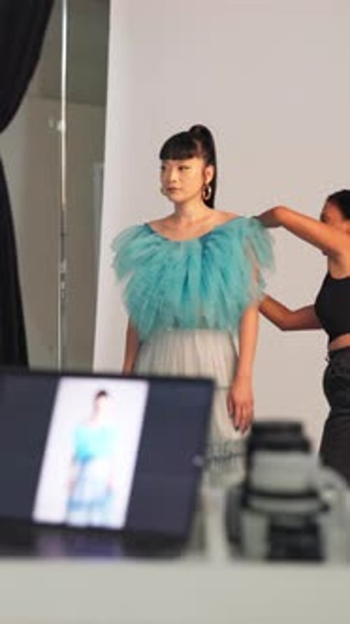 BTS, photography and styling with model in studio for advertising campaign or fashion magazine