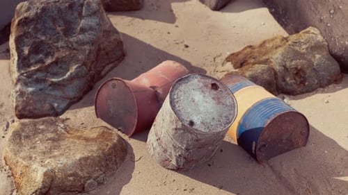 Old Oil Barrell on the Sand Beach
