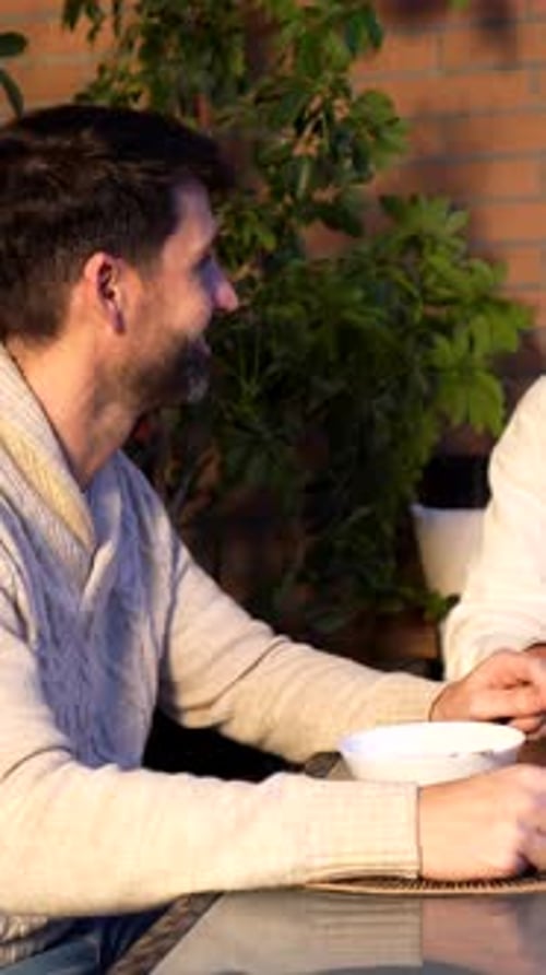 Couple enjoying breakfast on a terrace