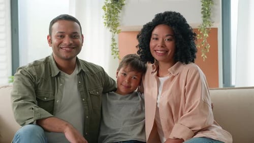 Happy Family Portrait on the Couch at Home