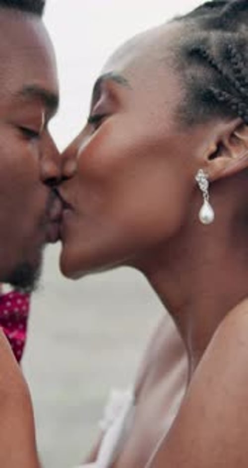 Affectionate Couple Embracing on Beach at Wedding