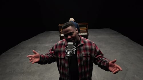 Pianist Playing With A Singer Inside A Studio